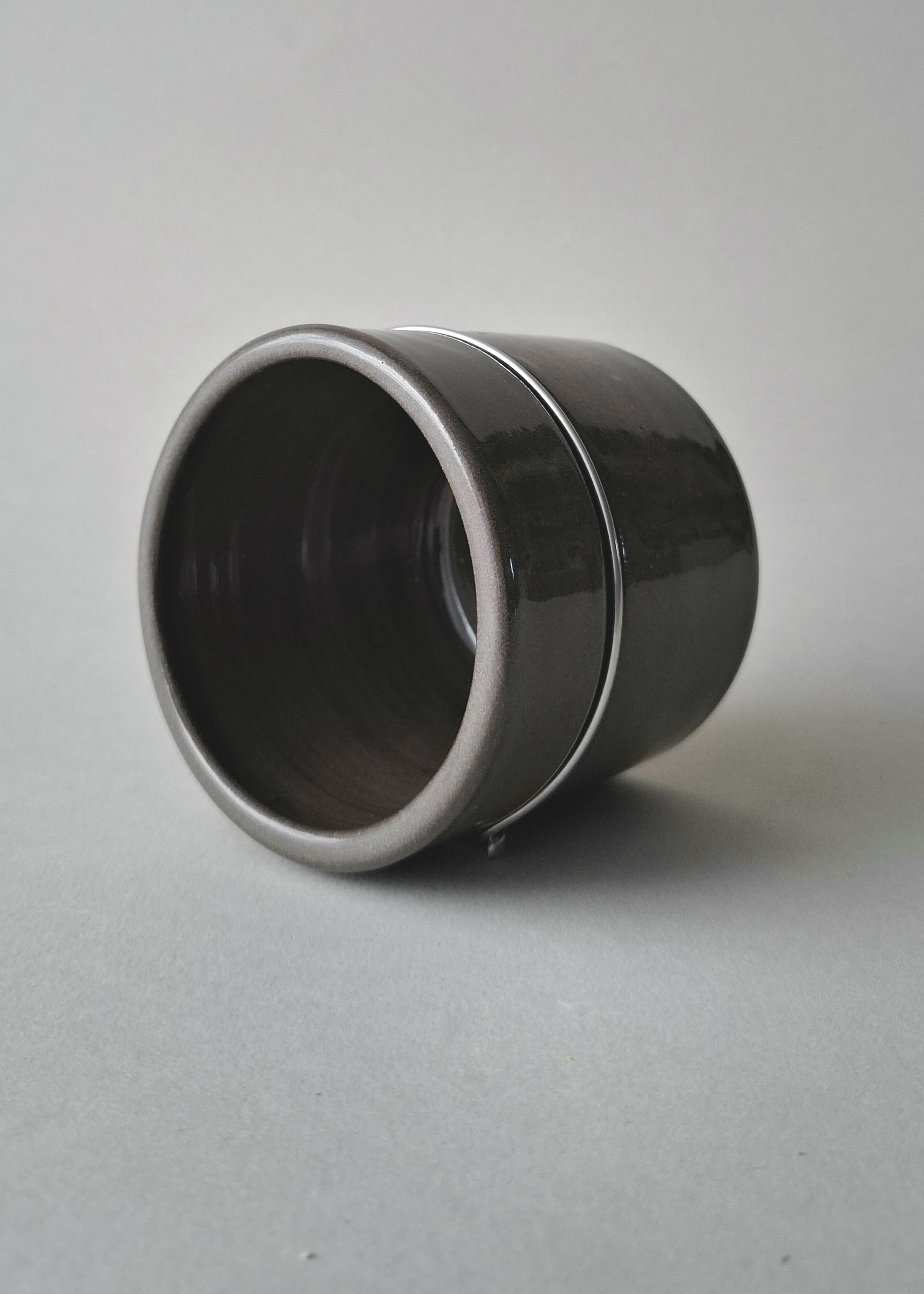 Handmade stoneware cup with anthracite glaze and signature stainless steel wire join. Wheel-thrown in Berlin. One of a kind.