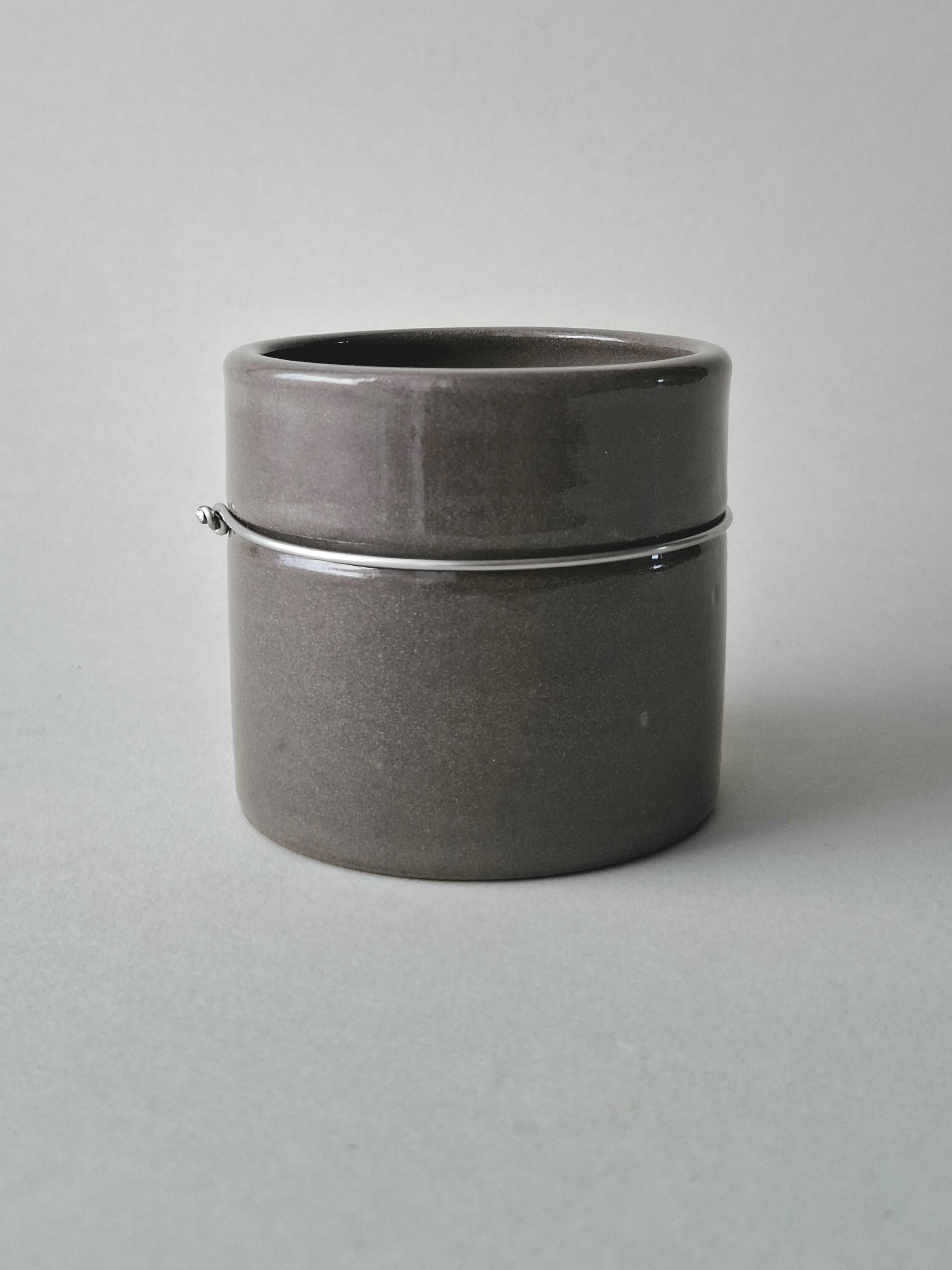 Handmade stoneware cup with anthracite glaze and signature stainless steel wire join. Wheel-thrown in Berlin. One of a kind.